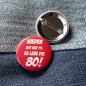 Preview: Ansteckbutton Nieder mit der 79 - es lebe die 80 auf Jeans mit Rückseite